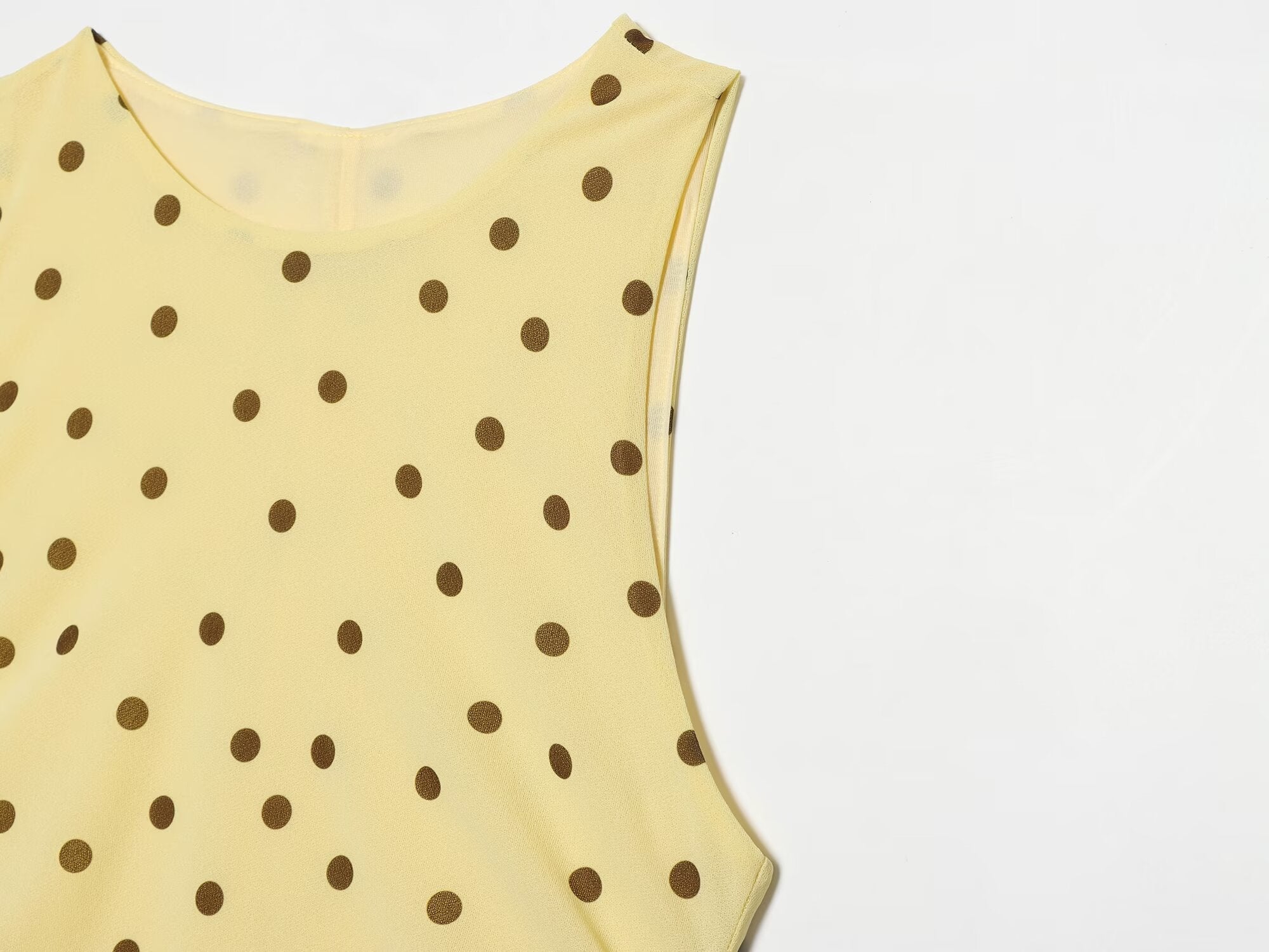 Women's sleeveless polka dot draped dress