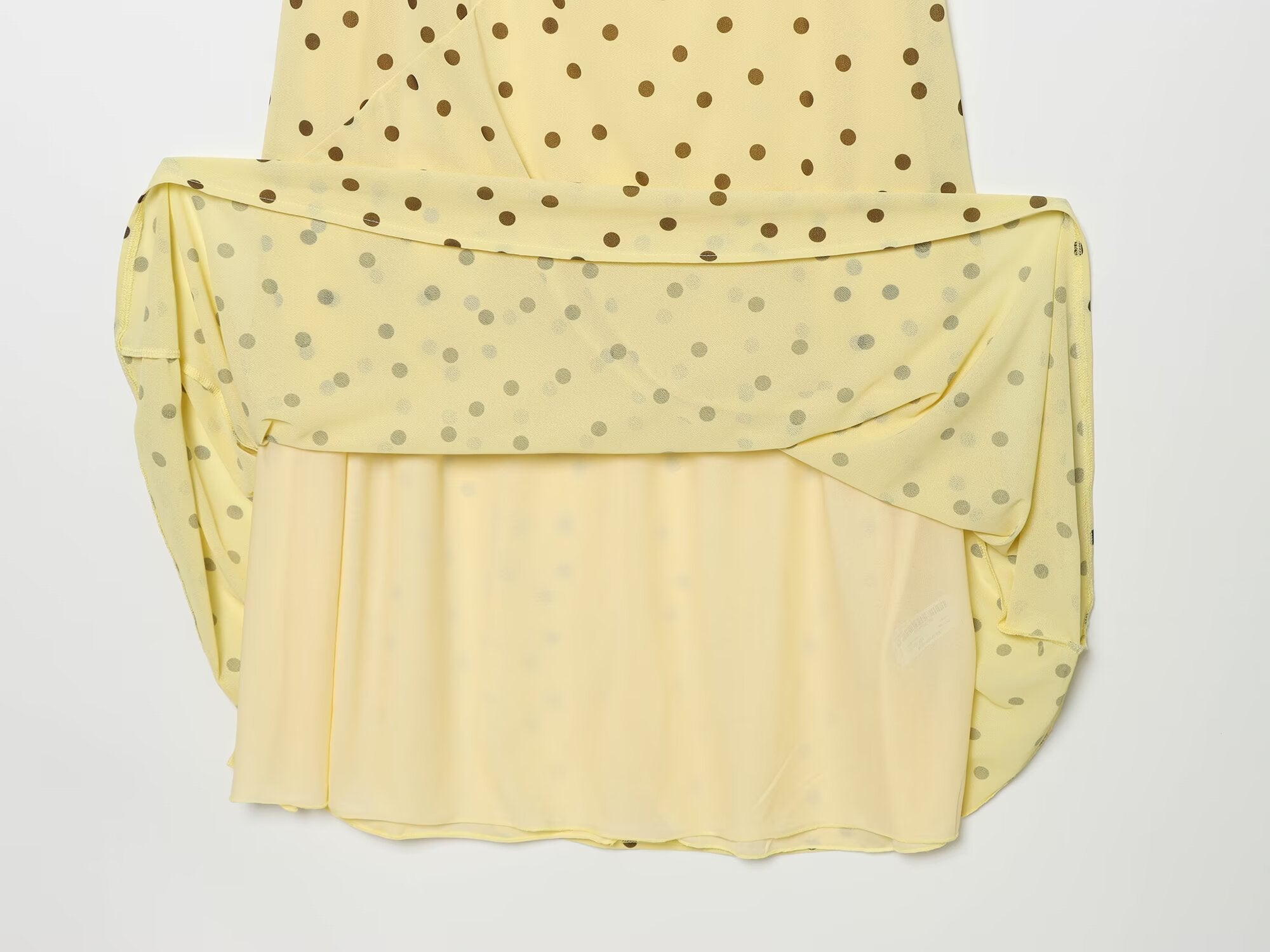 Women's sleeveless polka dot draped dress