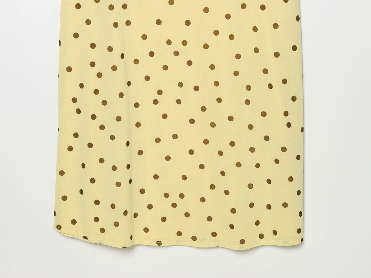 Women's sleeveless polka dot draped dress