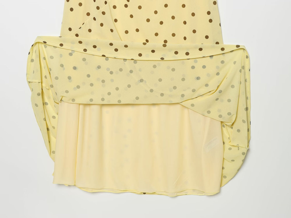 Women's sleeveless polka dot draped dress